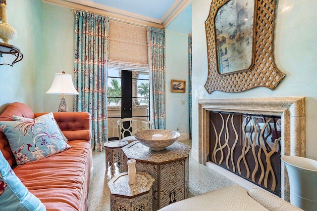 living room featuring a fireplace, french doors, and crown molding