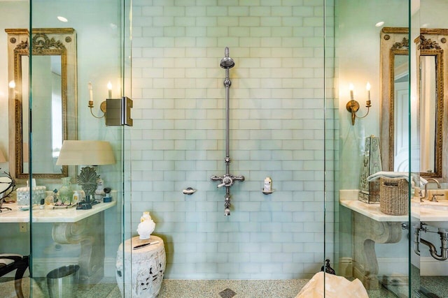 bathroom featuring a shower with door