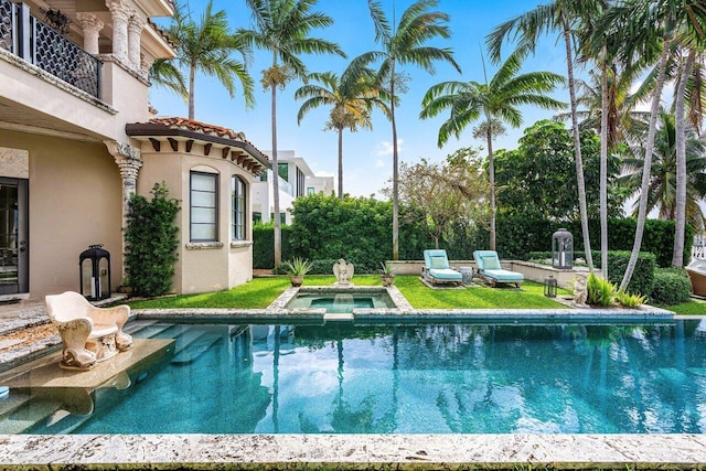 view of swimming pool featuring an in ground hot tub