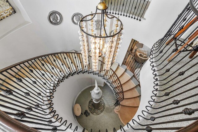 813 N Atlantic Dr, Lantana, FL 33462 - stairs with a chandelier