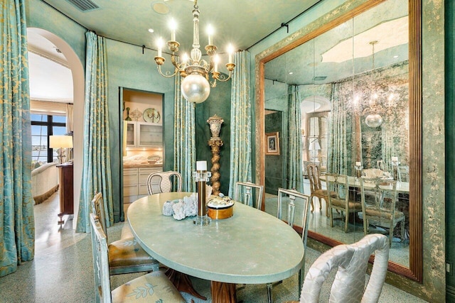 dining area featuring a chandelier