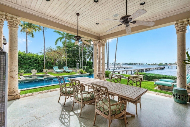 view of patio / terrace with a water view and ceiling fan