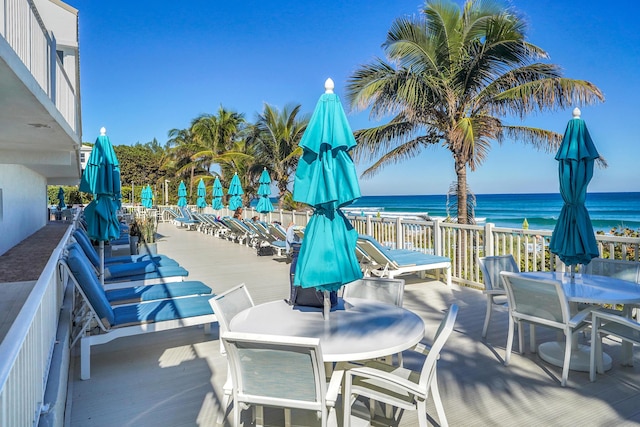 view of patio with a water view