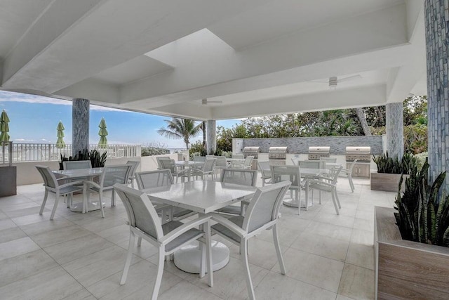 view of patio / terrace featuring an outdoor kitchen and a grill