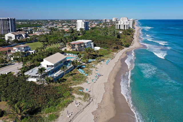 aerial view with a view of the beach and a water view