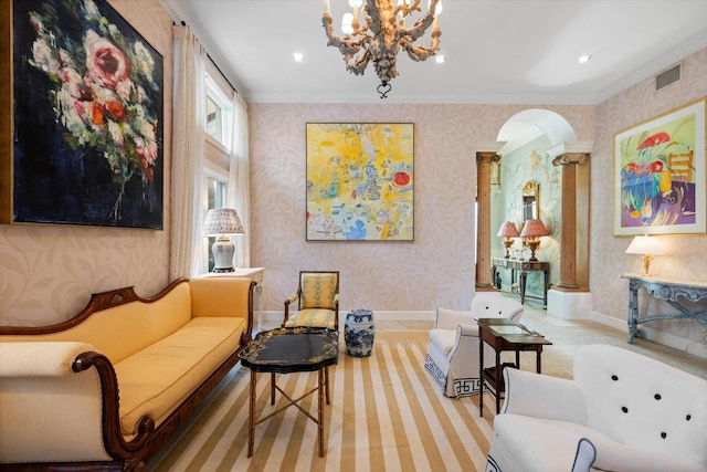 interior space with decorative columns, crown molding, and a notable chandelier