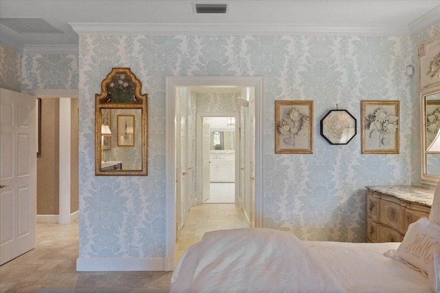 bedroom featuring ensuite bath and crown molding