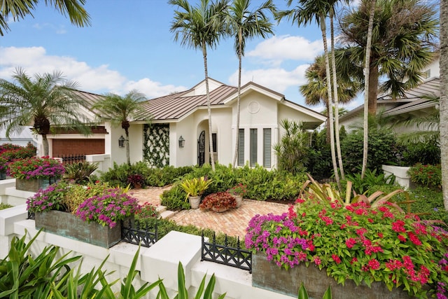 mediterranean / spanish-style house featuring a garage