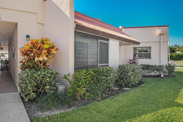 view of home's exterior with a yard