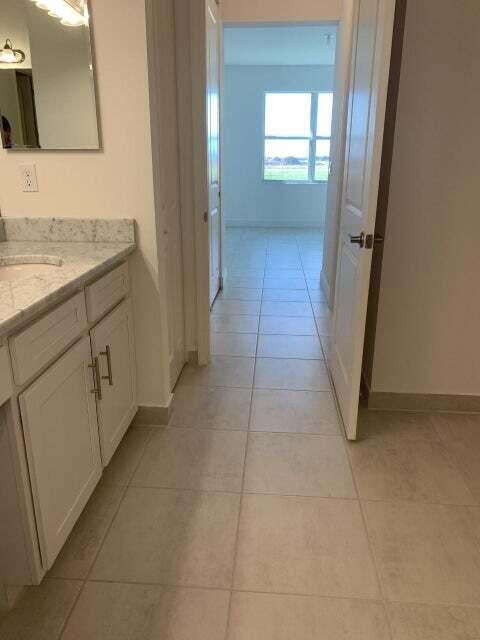 bathroom featuring tile patterned floors and vanity