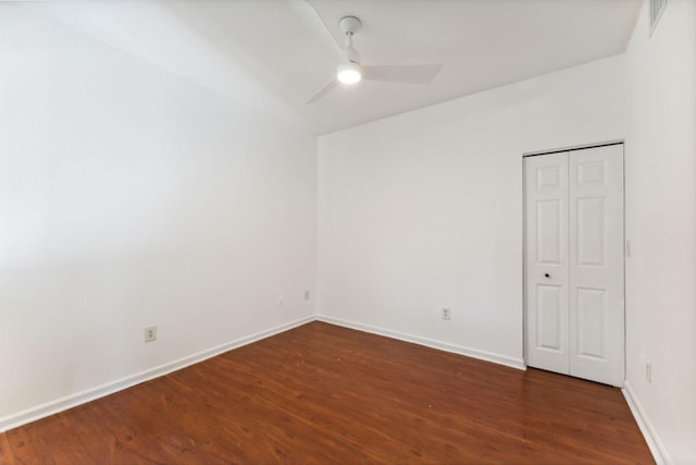 unfurnished bedroom with ceiling fan and dark hardwood / wood-style floors