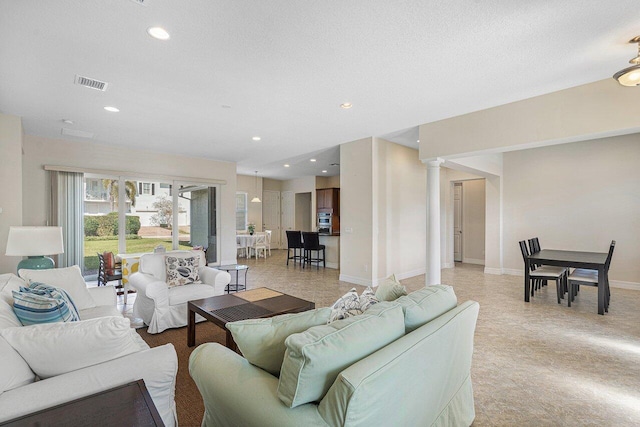 living room with a textured ceiling