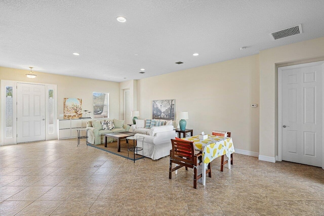 living room featuring a textured ceiling