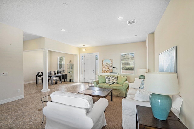 living room featuring a textured ceiling