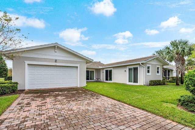 ranch-style home with a front yard and a garage