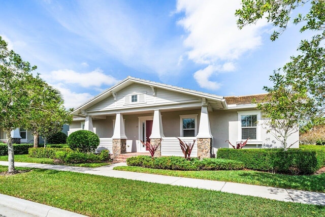 view of front of home with a front lawn