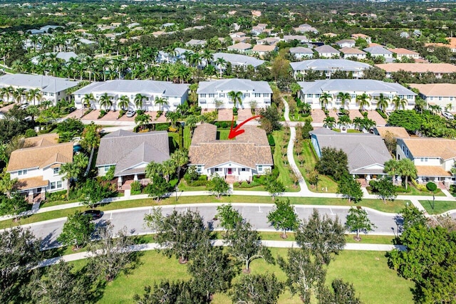 birds eye view of property with a residential view