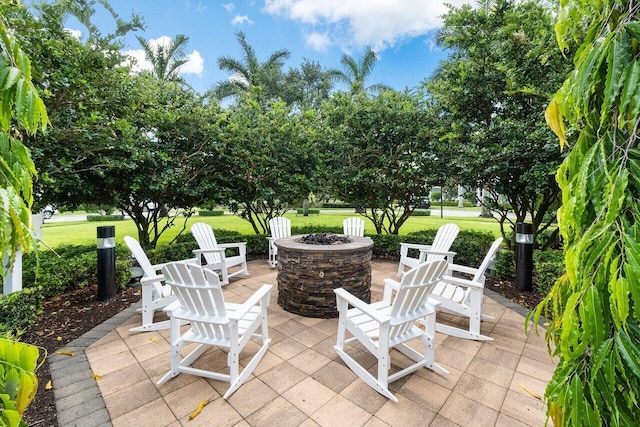 view of patio / terrace with an outdoor fire pit