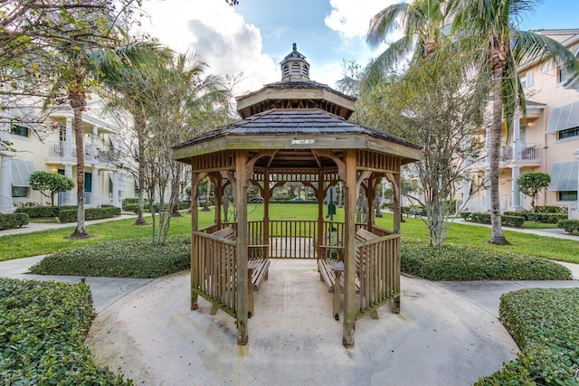 view of community with a lawn and a gazebo