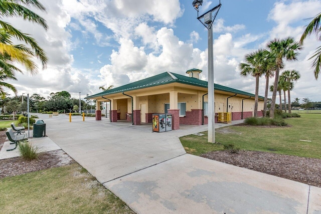 exterior space featuring a front lawn