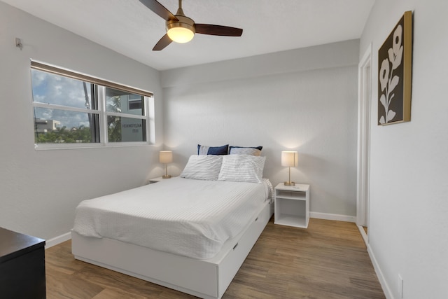 bedroom featuring ceiling fan and hardwood / wood-style flooring