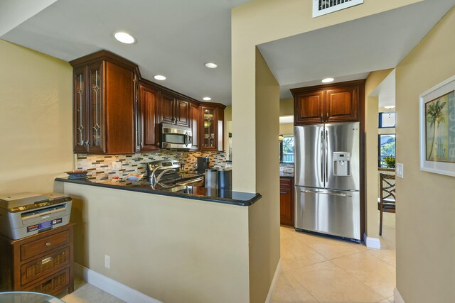 dining space with ceiling fan, light tile patterned floors, and high vaulted ceiling