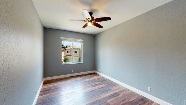 unfurnished room featuring ceiling fan and light hardwood / wood-style flooring