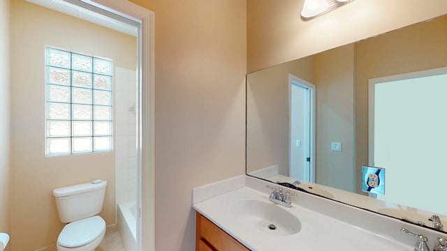 bathroom featuring tile patterned flooring, vanity, and toilet