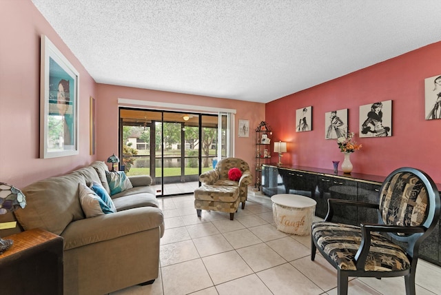 tiled living room featuring a textured ceiling