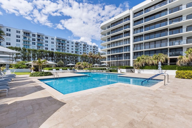 view of swimming pool with a patio