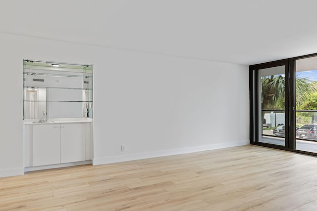 unfurnished room featuring light hardwood / wood-style floors