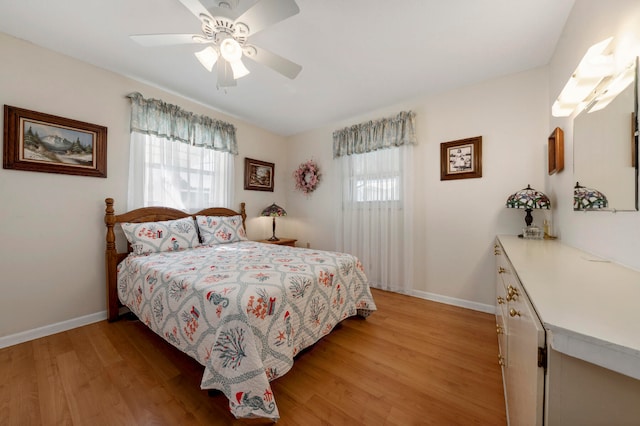 bedroom with ceiling fan and light wood-type flooring