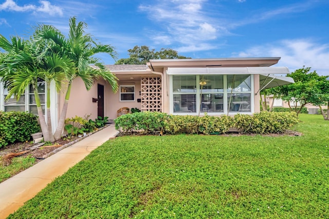 exterior space with a front lawn