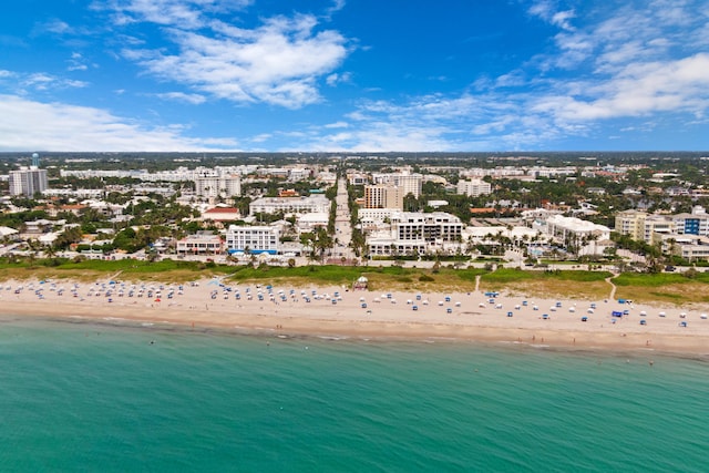 drone / aerial view with a view of the beach and a water view