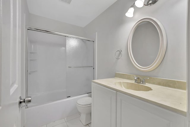 full bathroom with toilet, tile patterned flooring, enclosed tub / shower combo, and vanity