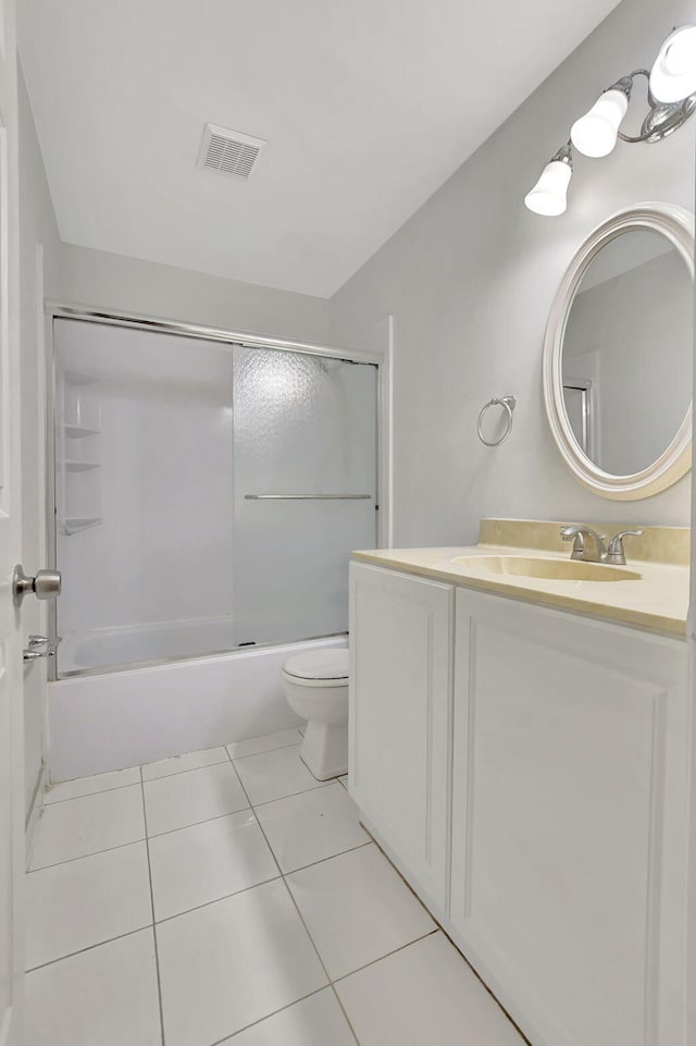 full bathroom featuring vanity,  shower combination, toilet, and tile patterned flooring