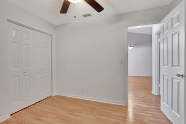 unfurnished bedroom featuring a closet, ceiling fan, and light hardwood / wood-style floors