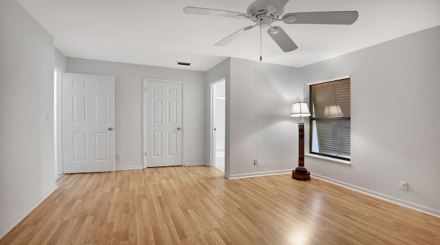 unfurnished bedroom with light hardwood / wood-style floors and ceiling fan