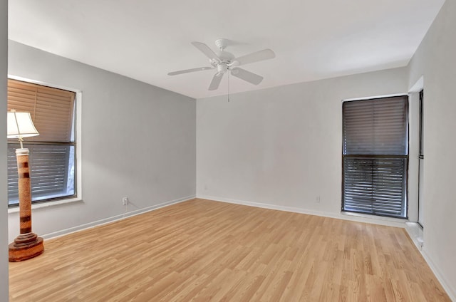 unfurnished room featuring ceiling fan and light wood-type flooring