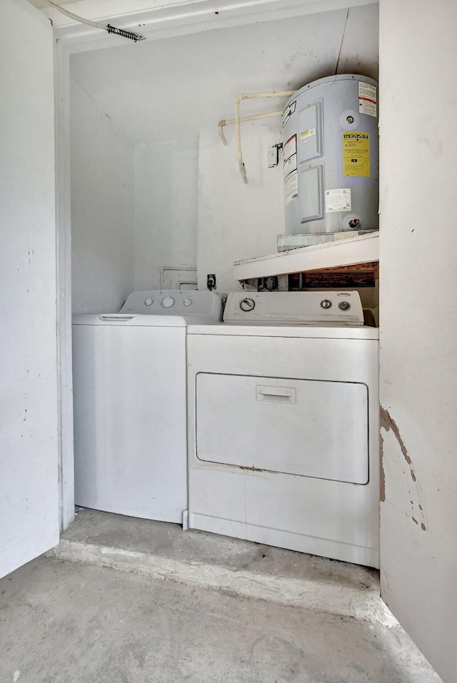 laundry room featuring washer and clothes dryer and water heater