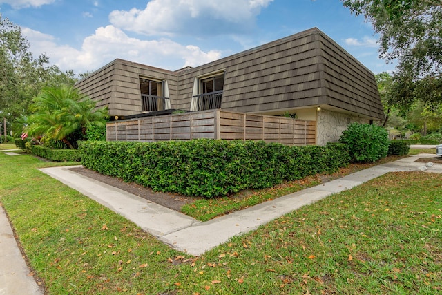 view of home's exterior featuring a yard