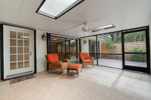 sunroom featuring ceiling fan and a healthy amount of sunlight