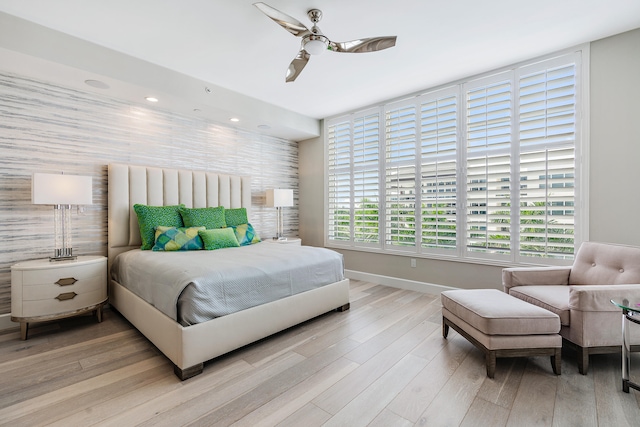 bedroom featuring light hardwood / wood-style floors and ceiling fan