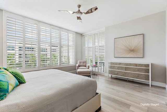 bedroom featuring light wood-type flooring and ceiling fan