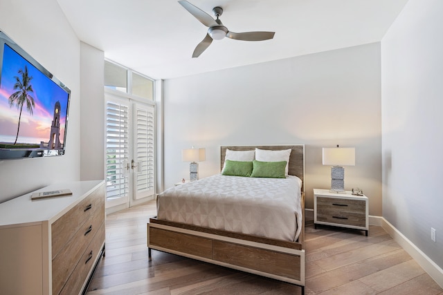 bedroom with access to exterior, ceiling fan, and light hardwood / wood-style flooring