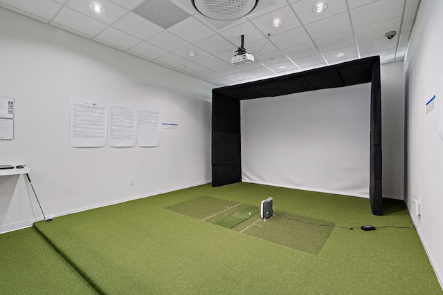 home theater room with a drop ceiling and carpet