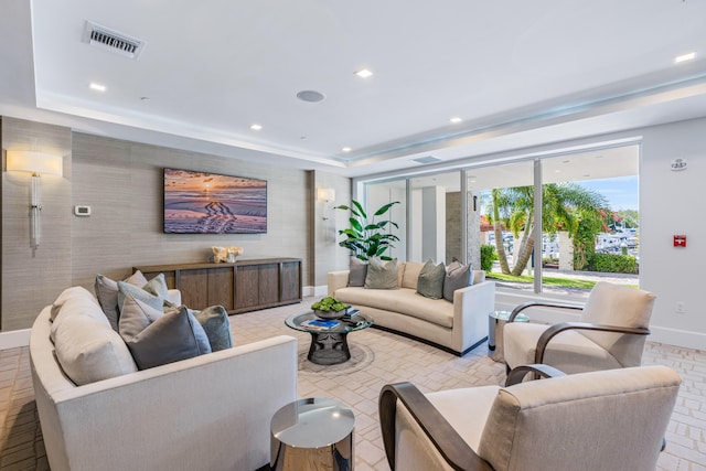 living room featuring a tray ceiling