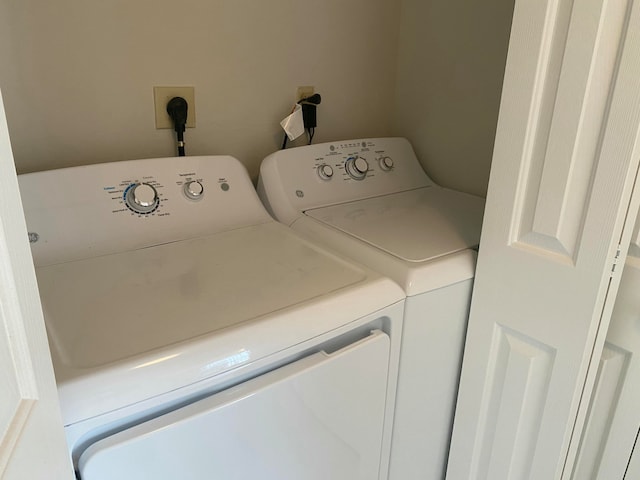 laundry room featuring washing machine and dryer