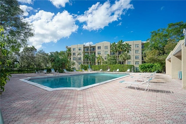 view of swimming pool with a patio area