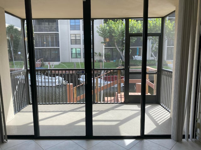 interior space featuring tile patterned floors and a wall of windows